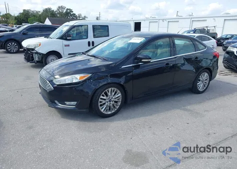 2015 Ford Focus Titanium z USA, uszkodzony, nr VIN 1FADP3J25FL338697